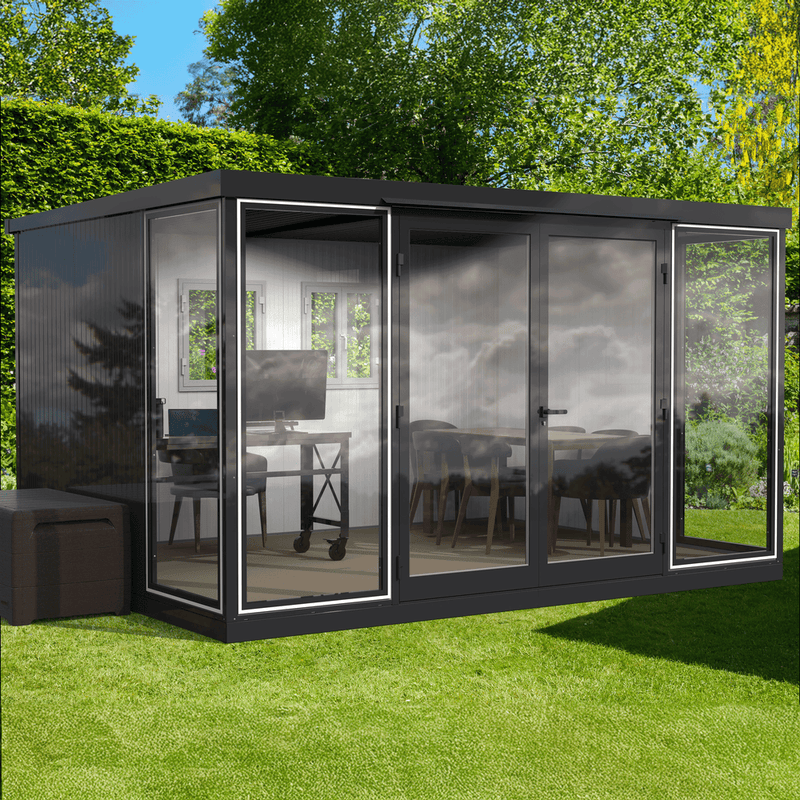 Backyard studio setup featuring the 13x10 Duramax glass room with office desk and dining area.