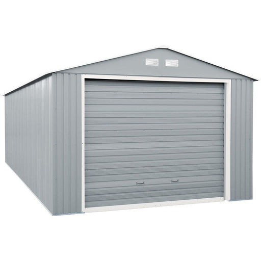 Duramax Imperial metal garage, 12x20, displayed at an angle, highlighting its light gray color and off white trim with a closed roll-up door.