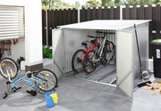 Duramax 6'x6' bicycle storage shed in anthracite with white trim, showcasing an open door with multiple bikes stored inside, perfect for secure and organized bike storage in a modern setting.