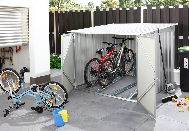 Duramax 6'x6' bicycle storage shed in anthracite with white trim, showcasing an open door with multiple bikes stored inside, perfect for secure and organized bike storage in a modern setting.