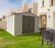 Duramax Woodbridge Plus 10.5'x10' shed installed in a suburban backyard, showcasing its robust structure and ample space for garden tools and outdoor furniture storage.