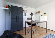 The insulated 10x10 glass building of Duramax as an office.