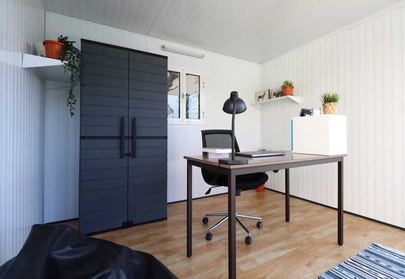 The insulated 10x10 glass building of Duramax as an office.
