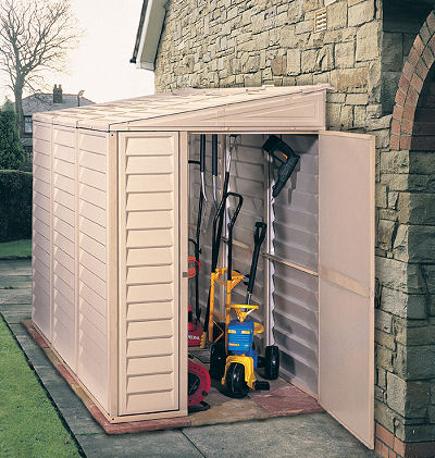 Duramax SideMate Shed w/ Foundation 4x8 - Backyard Oasis placed outside; door open with things inside