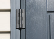 A close up of a Duramax StoreMax Plus 10.5 X 8 - 30225 door with a black handle. hinge details