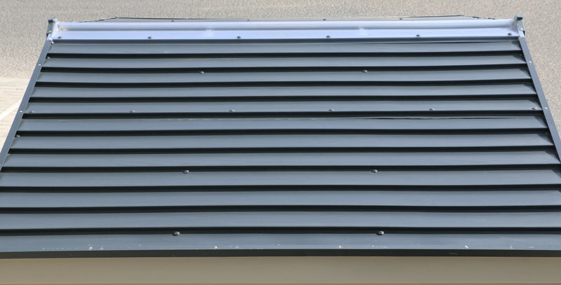 The Duramax StoreMax Plus 10.5 X 8 - 30225 roof of a house with a metal soffit. roof detail close up