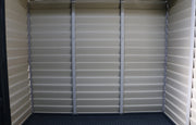 The inside of a Duramax StoreMax Plus 10.5 X 8 - 30225 storage shed with a door. wall details