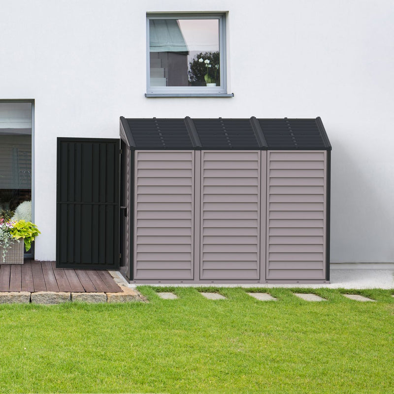 Elegant and compact Duramax The SideMate 4'x8' Vinyl Shed on a backyard deck, showcasing its efficient storage capability and sleek design.