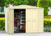 Duramax Duramate 8'x5.3' Vinyl Shed with one door open, set in a lush garden, showcasing interior space and sturdy design.