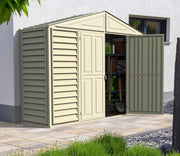Duramax Sidepro 10.5'x3' storage shed in an outdoor setting with one door open, revealing interior storage space filled with garden tools and equipment.